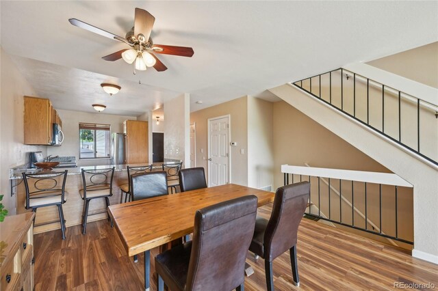 7474 E Arkansas Ave Unit 13-02, Denver, CO 80231 - dining area featuring wood finished floors and ceiling fan