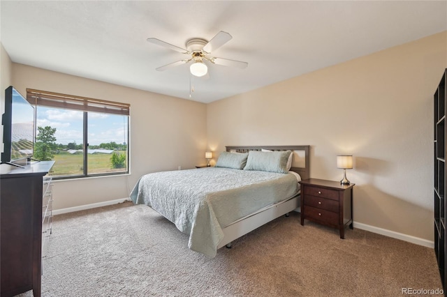 7474 E Arkansas Ave Unit 13-02, Denver, CO 80231 - carpeted bedroom with baseboards and ceiling fan