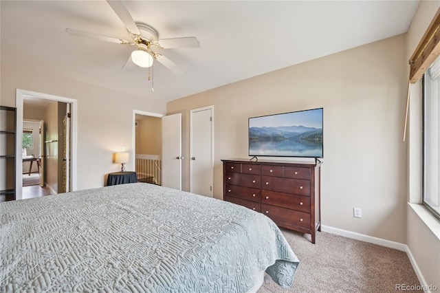 7474 E Arkansas Ave Unit 13-02, Denver, CO 80231 - carpeted bedroom with multiple windows, baseboards, and a ceiling fan