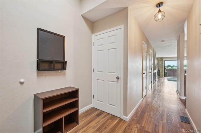 7474 E Arkansas Ave Unit 13-02, Denver, CO 80231 - hall featuring wood finished floors and baseboards