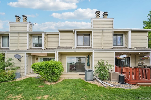 7474 E Arkansas Ave Unit 13-02, Denver, CO 80231 - rear view of property with a chimney, central air condition unit, a lawn, and a shingled roof