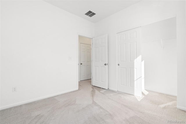 unfurnished bedroom with visible vents, baseboards, and carpet flooring