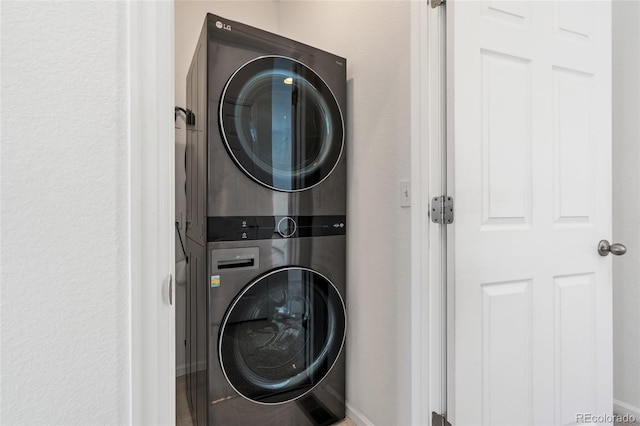 laundry area featuring laundry area and stacked washing maching and dryer