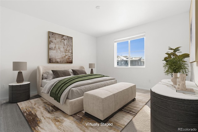 carpeted bedroom with baseboards