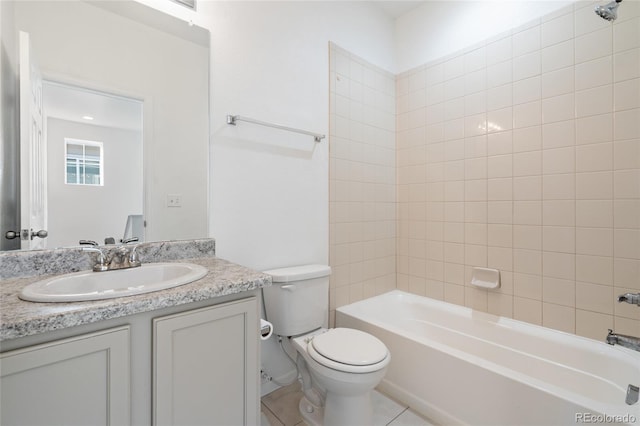 bathroom featuring vanity, bathing tub / shower combination, toilet, and tile patterned flooring