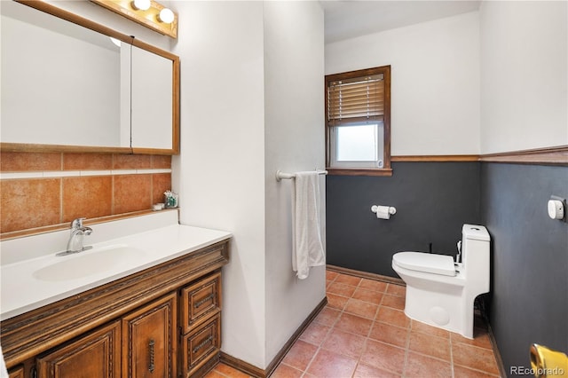 4567 Grove St, Denver, CO 80211 - bathroom with vanity, toilet, baseboards, and tile patterned flooring
