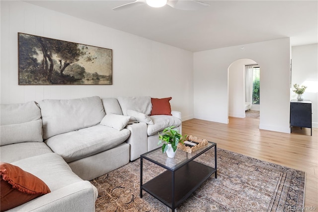 4567 Grove St, Denver, CO 80211 - living area with arched walkways, wood finished floors, ceiling fan, and baseboards