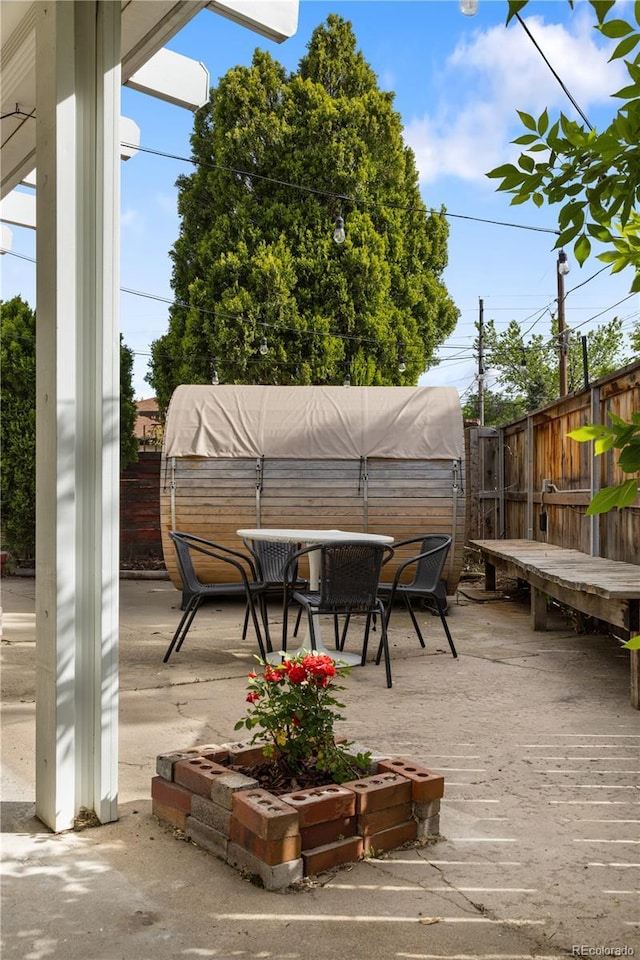 4567 Grove St, Denver, CO 80211 - deck featuring a fenced backyard and outdoor dining area