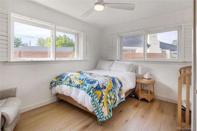4567 Grove St, Denver, CO 80211 - bedroom featuring baseboards, light wood-style floors, multiple windows, and a ceiling fan
