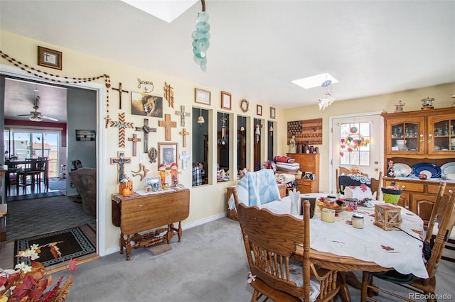 222 S Logan St, Grover, CO 80729 - carpeted dining space with a skylight, plenty of natural light, and ceiling fan