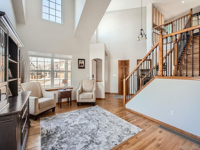 interior space with light wood finished floors, stairway, and plenty of natural light