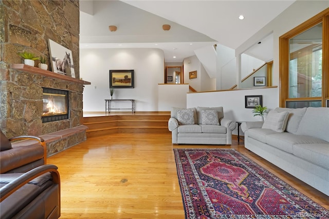 2398 Bitterroot Ln, Golden, CO 80401 - living room with wood finished floors, a stone fireplace, and recessed lighting