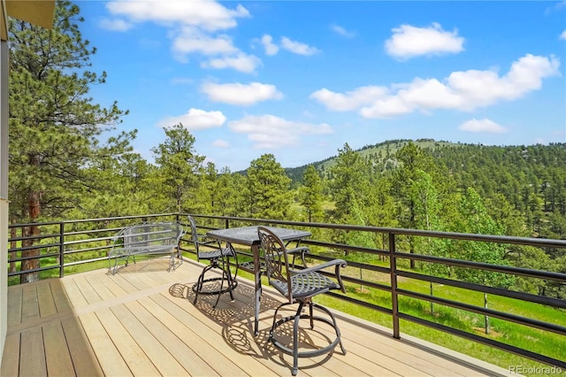 2398 Bitterroot Ln, Golden, CO 80401 - wooden deck featuring a forest view