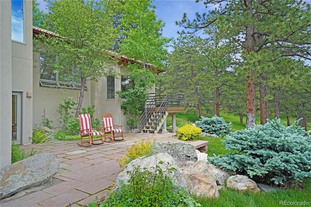 2398 Bitterroot Ln, Golden, CO 80401 - view of yard featuring stairway, a patio, and a wooden deck