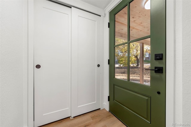 entryway with light hardwood / wood-style floors