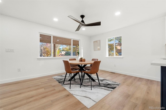 dining space featuring ceiling fan and light hardwood / wood-style floors