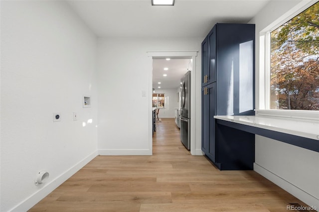 hall with light hardwood / wood-style flooring