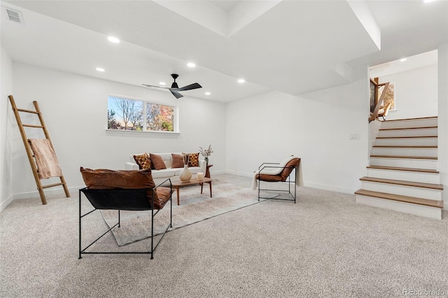 living room with light colored carpet and ceiling fan