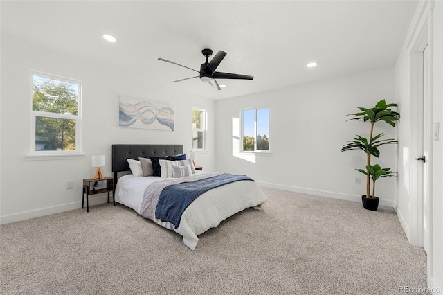 bedroom with light colored carpet and ceiling fan