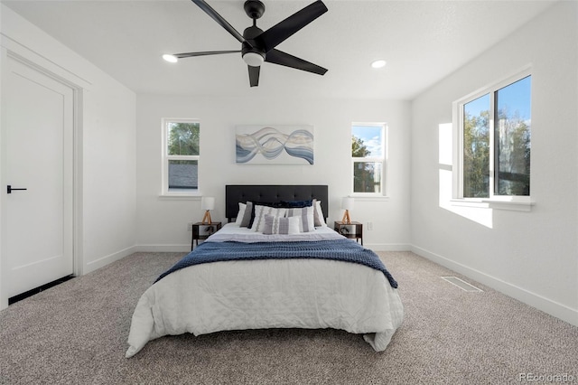 carpeted bedroom featuring ceiling fan