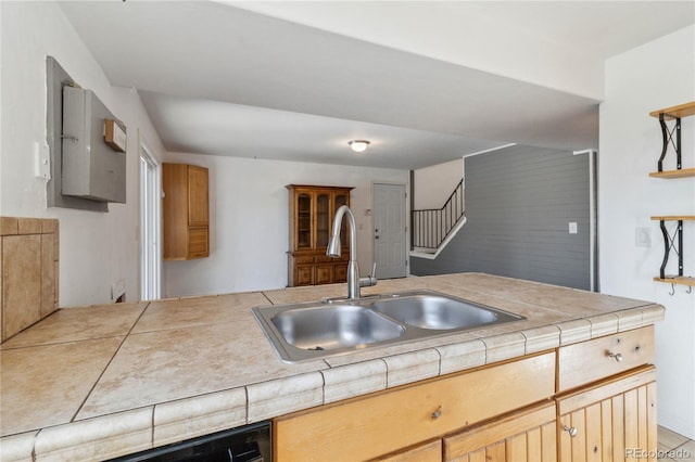 kitchen featuring sink and tile countertops