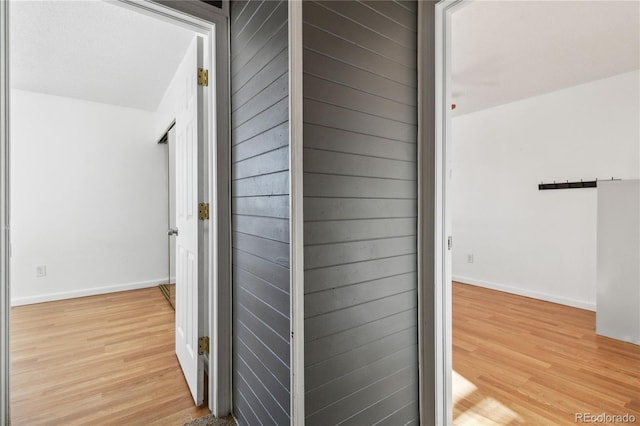 hall with light wood-type flooring