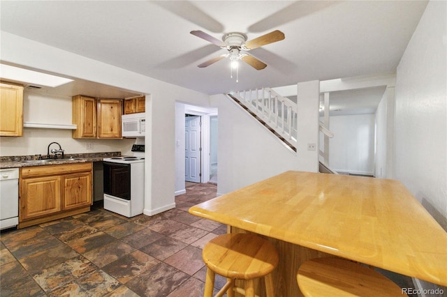 kitchen with ceiling fan, sink, and white appliances