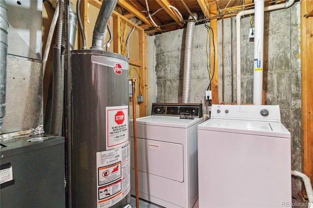 washroom featuring separate washer and dryer and water heater