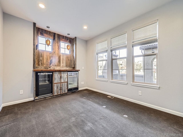 2256 S Isabell Ct, Lakewood, CO 80228 - indoor dry bar with wine cooler, dark carpet, baseboards, and recessed lighting