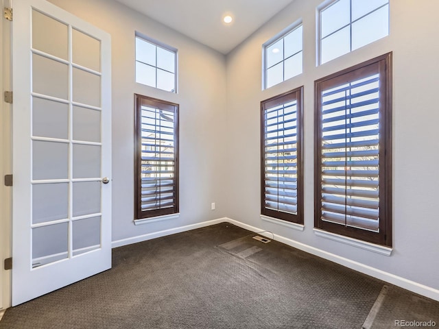 2256 S Isabell Ct, Lakewood, CO 80228 - empty room featuring dark carpet, baseboards, and recessed lighting