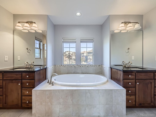 2256 S Isabell Ct, Lakewood, CO 80228 - full bathroom featuring tile patterned floors, a bath, two vanities, and recessed lighting