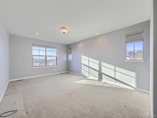 2256 S Isabell Ct, Lakewood, CO 80228 - unfurnished room featuring healthy amount of natural light, carpet floors, baseboards, and recessed lighting