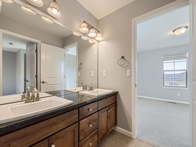 2256 S Isabell Ct, Lakewood, CO 80228 - full bath with double vanity, baseboards, and tile patterned flooring