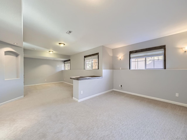 2256 S Isabell Ct, Lakewood, CO 80228 - empty room featuring light colored carpet, plenty of natural light, and baseboards