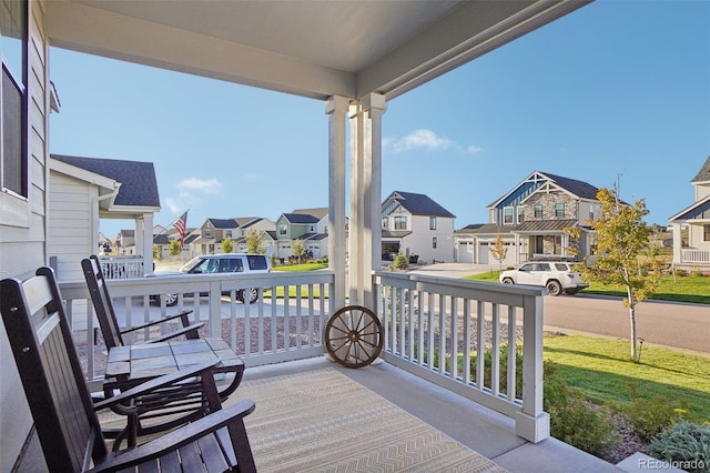 exterior space featuring covered porch and a lawn