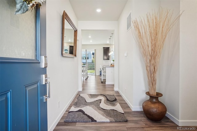 entryway with hardwood / wood-style floors