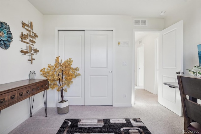 entryway with light carpet