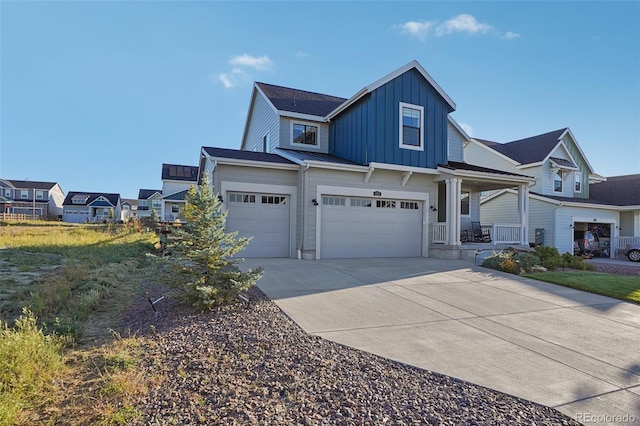 view of front of property featuring a porch and a garage