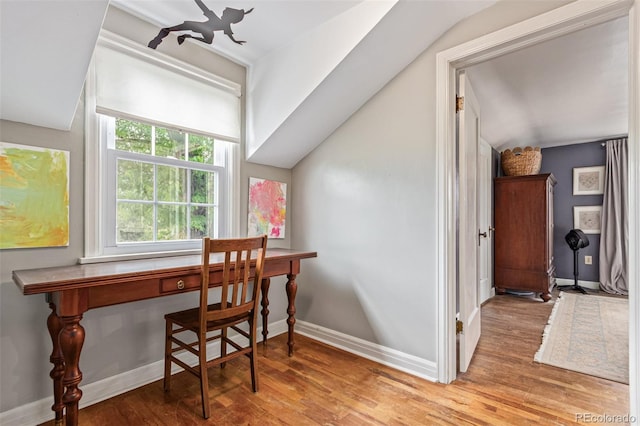 134 S 5th Ave, Brighton, CO 80601 - office space featuring wood finished floors, baseboards, and lofted ceiling
