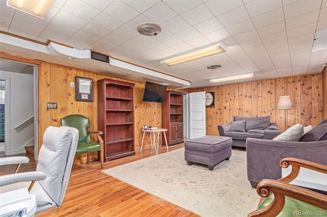 134 S 5th Ave, Brighton, CO 80601 - living room featuring wood finished floors and wooden walls