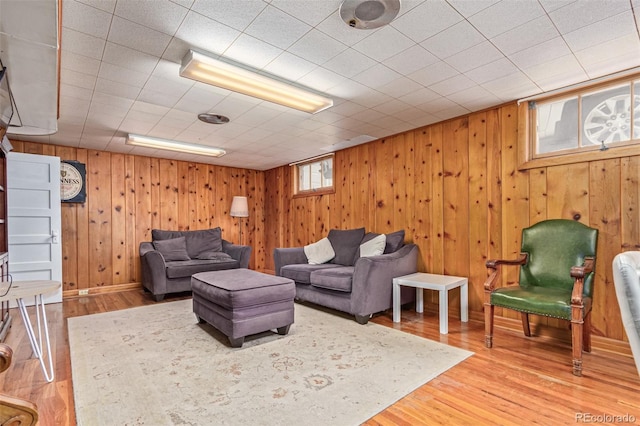 134 S 5th Ave, Brighton, CO 80601 - living room with wood walls and light wood-style flooring