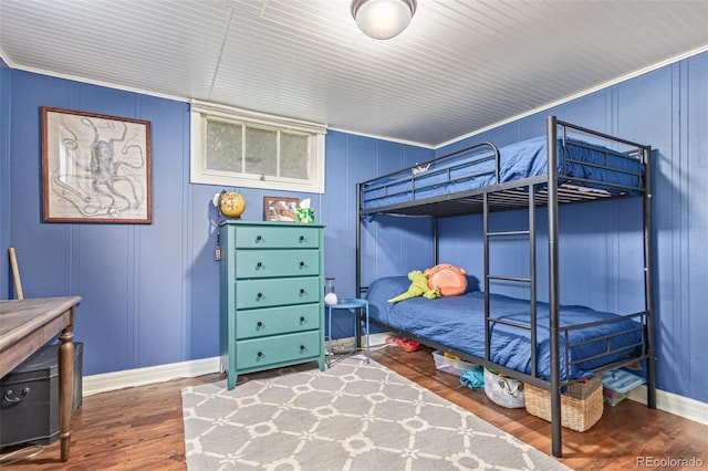 134 S 5th Ave, Brighton, CO 80601 - bedroom with a decorative wall, wood finished floors, and baseboards