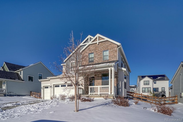 view of front of home with a garage and covered porch