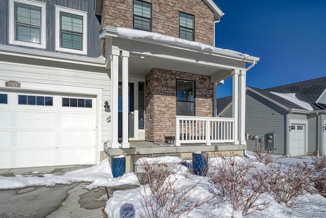 view of front facade featuring a garage and a porch