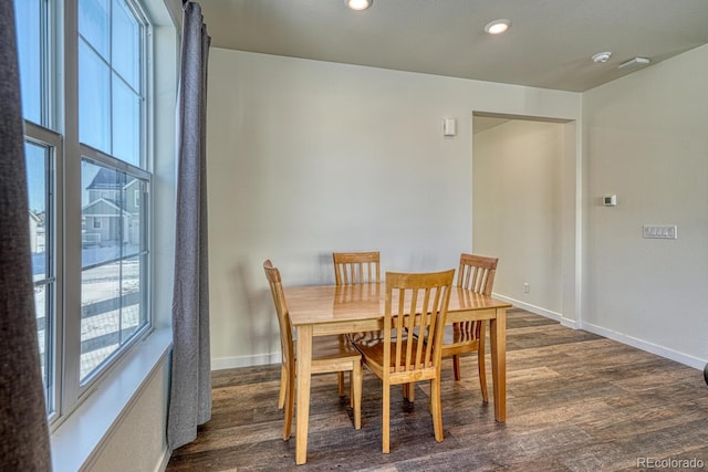 dining area featuring dark hardwood / wood-style flooring