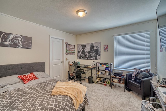 carpeted bedroom featuring a textured ceiling