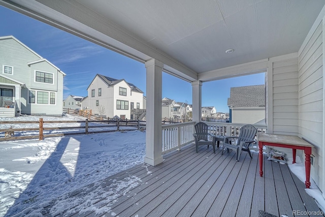 view of snow covered deck