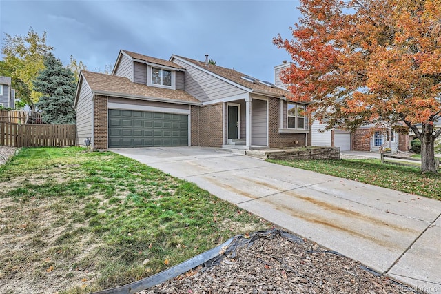 view of front of house featuring a garage and a front yard