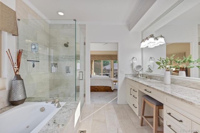 6874 Raspberry Run, Littleton, CO 80125 - ensuite bathroom with ornamental molding, vanity, a shower stall, a jetted tub, and tile patterned floors