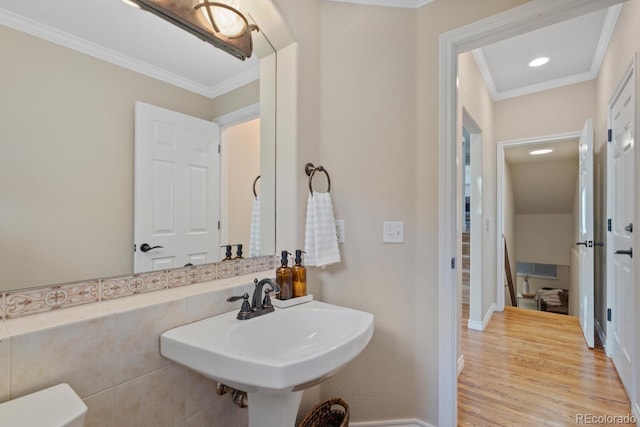 6874 Raspberry Run, Littleton, CO 80125 - half bathroom featuring ornamental molding, wood finished floors, baseboards, and recessed lighting